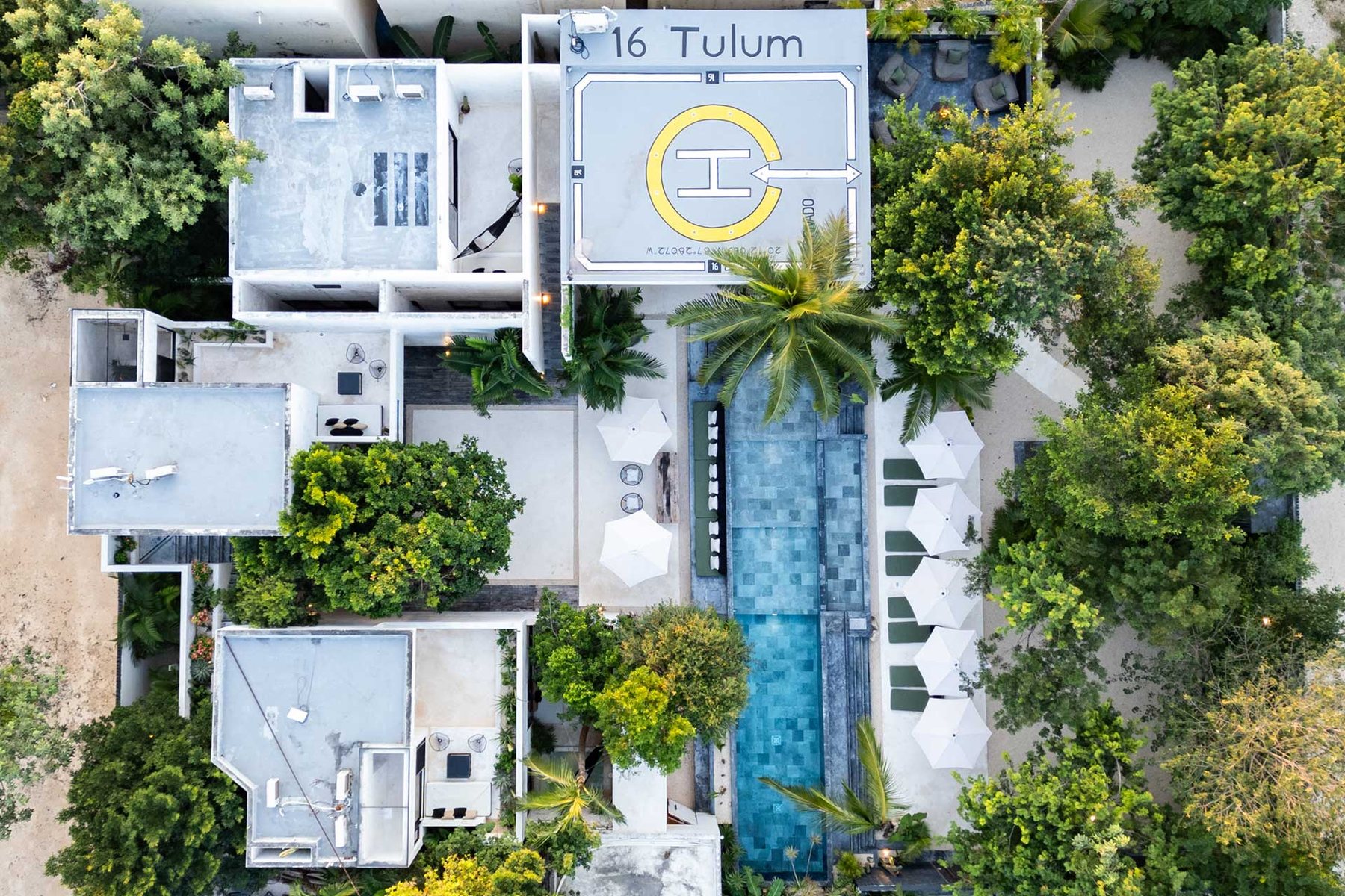 Top-down view of 16 Tulum: pool, loungers, terraces and helipad