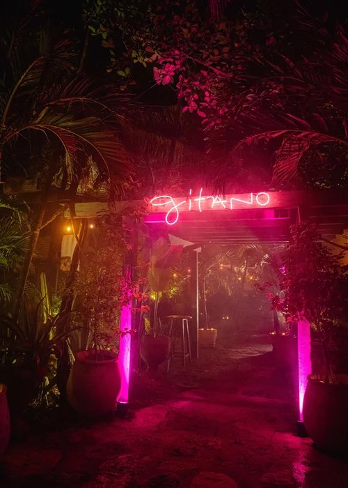 Entrance with the Gitano neon sign at night